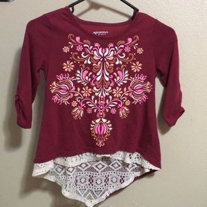 Maroon long sleeve shirt;designs on front